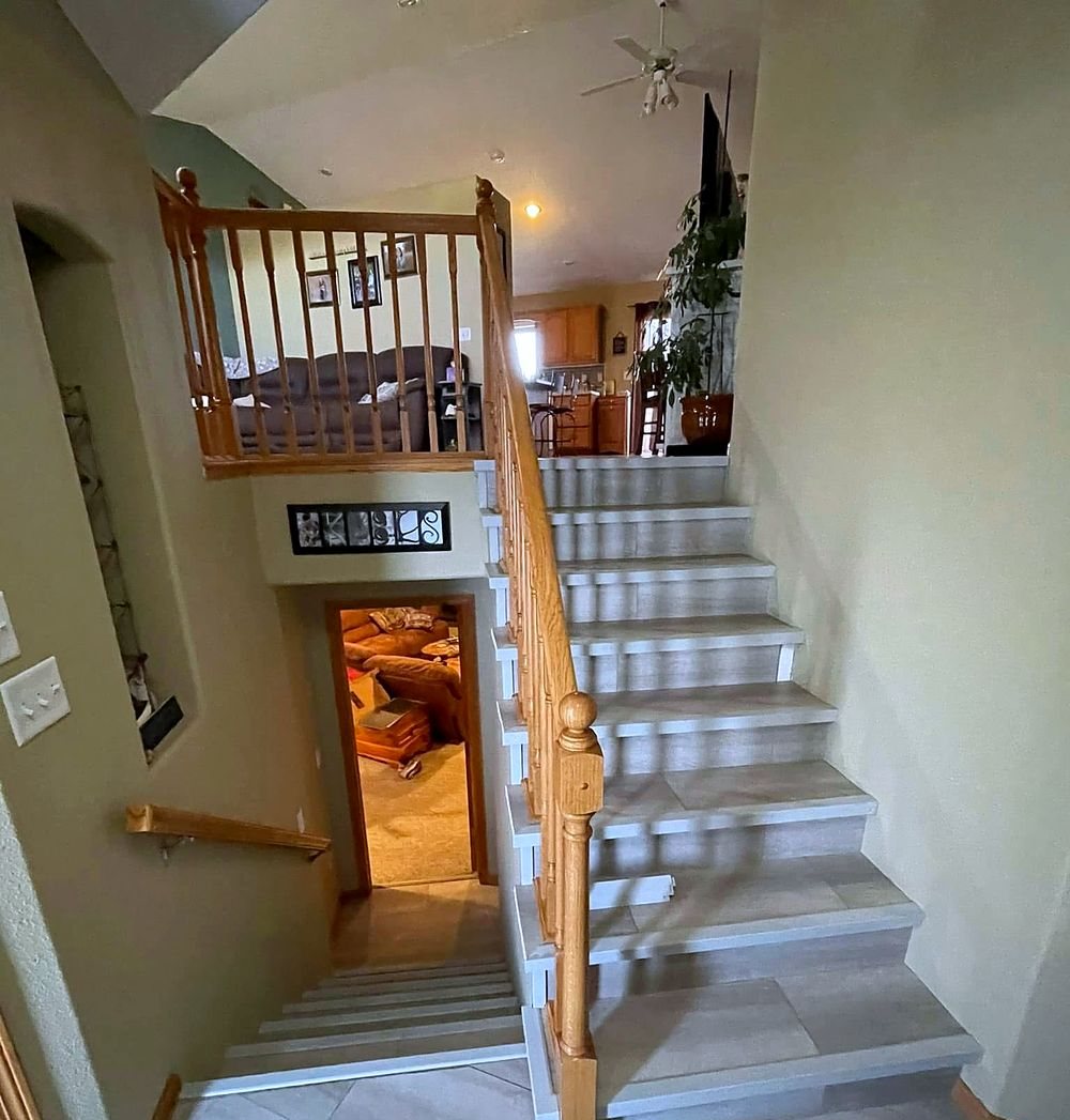 Staircase before — dated oak spindle railing