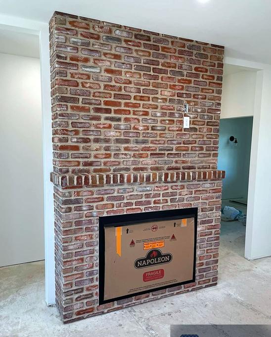 Floor-to-ceiling brick fireplace