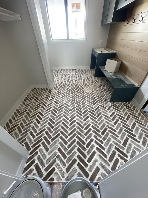 Herringbone mosaic mudroom floor